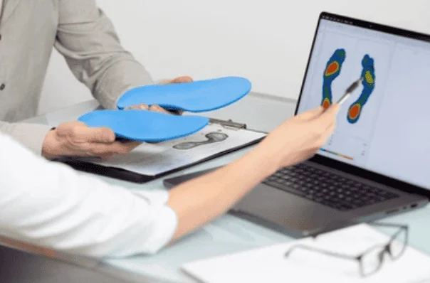 Doctor explaining 3D orthotics to a patient