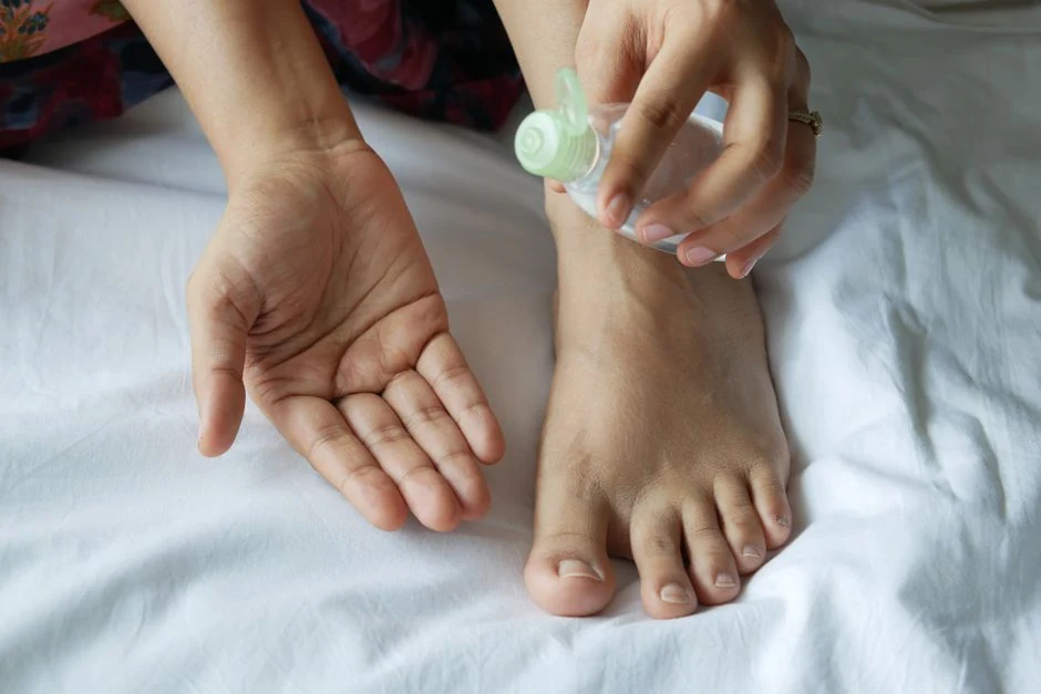 Applying moisturizer during a daily foot-care routine.